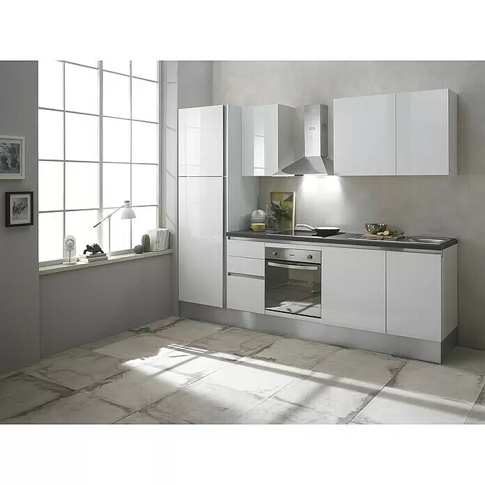 Marinelli Cucine Vormontierte Küchenzeile Giulia - Breite: 275 cm, Weiß, Mit Elektrogeräten, Dekor Arbeitsplatte: Steinoptik, Spüle rechts - Elegante hochglanzweiße Küche mit dunkelgrauer Arbeitsplatte, integriertem Backofen, Kochfeld und Spüle.