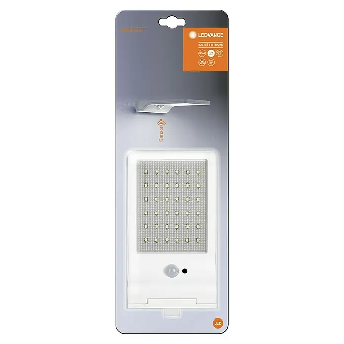 Osram Aplique solar para exterior DoorLED - 3 W, L x An x Al: 19,2 x 11 x 3 cm, Blanco, IP44, 320 lm - Imagen de una lámpara de pared LED solar LEDVANCE con sensor de movimiento, empaquetada para la venta minorista, con especificaciones técnicas en el embalaje.