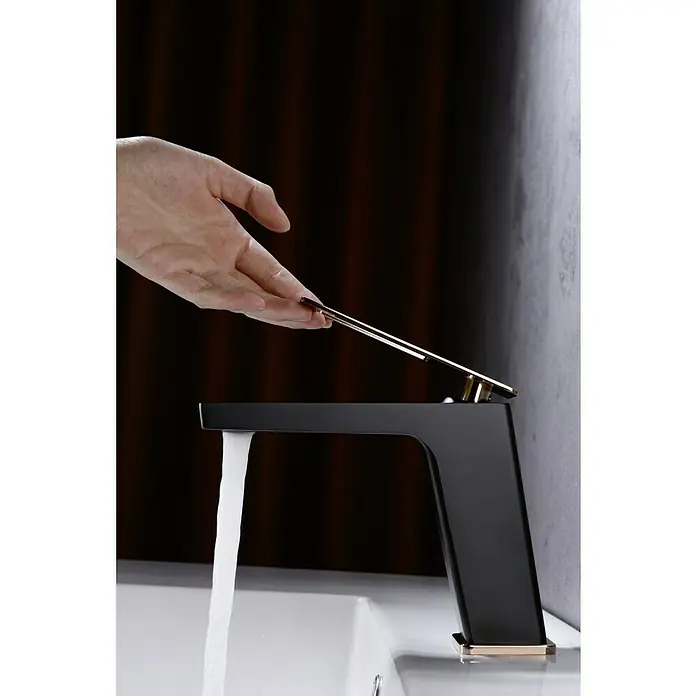 Imex Suecia Grifo de lavabo - Negro/Oro rosa, Mate - Elegante grifo negro con detalles dorados accionado por una mano, con agua corriente para diseños de baño modernos.