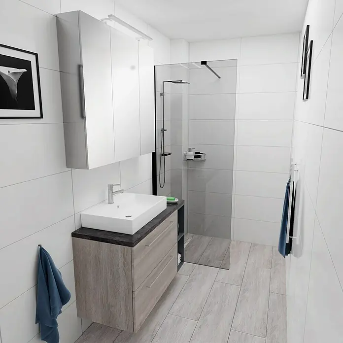 Camargue Espacio Badmöbel-Set i127 - 100 cm, Faro - Ein modernes Badezimmer mit einem Waschtischunterschrank in Holzoptik und einem weißen Aufsatzwaschbecken. Eine Duschkabine befindet sich im Hintergrund.