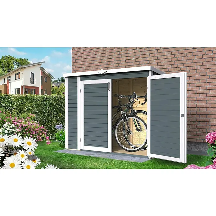 Bertilo Geräteschrank Multibox 3 - Anthrazitgrau - Ein graues Gartenhaus mit weißen Akzenten und geöffneten Türen, in dem ein Fahrrad steht. Die ideale Aufbewahrungslösung für den Garten.