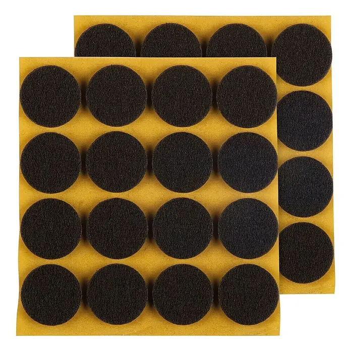 Stabilit Filzgleiter - Durchmesser: 22 mm, 32 Stk., Braun, Kleben - Nahaufnahme von zwei Blättern mit schwarzen, runden Filzgleitern mit Klebefläche zum Schutz von Möbeln und Böden.