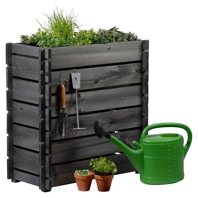 Dobar Hochbeet Stecksystem - L x B x H: 79 x 37 x 79 cm, Holz, Anthrazit - Dunkelgrauer Holz-Pflanzkasten mit Kräutern, kleinen Gartengeräten, grüner Gießkanne und zwei Terrakotta-Topfpflanzen.