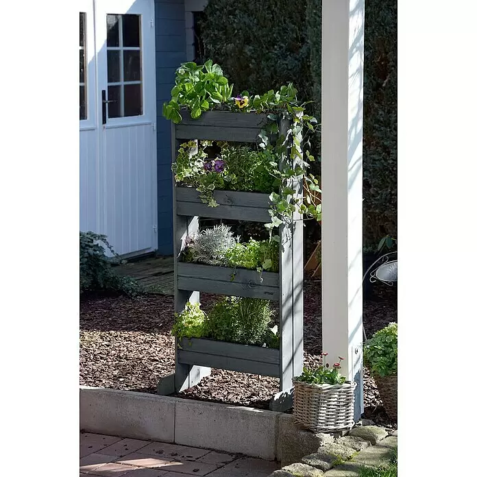 Dobar Hochbeet - L x B x H: 55 x 40 x 125 cm, Holz, Anthrazit - Graues vertikales Hochbeet aus Holz, gefüllt mit verschiedenen Pflanzen und Kräutern im Freien.