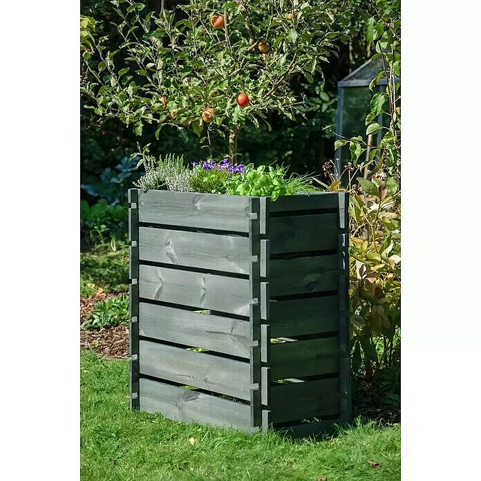 Dobar Hochbeet Stecksystem - L x B x H: 79 x 37 x 79 cm, Holz, Anthrazit - Graugrüner Holz-Lamellenpflanzkasten mit verschiedenen Pflanzen und lila Blumen, in einem sonnigen Garten stehend.