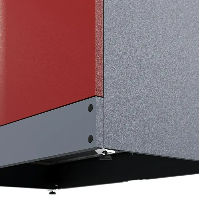 Küpper Werkstatt-Hochschrank - L x B x H: 45 x 91 x 180 cm, Anzahl Türen: 2 Stk. - Detailaufnahme einer modernen Heizungsanlage mit roter und grauer Verkleidung, die die hochwertige Verarbeitung und das Design hervorhebt.
