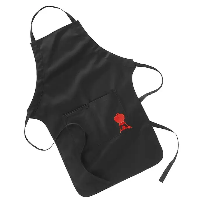 Weber Grillschürze - Textil, Schwarz - Schwarze Grillschürze mit rotem Grillmotiv auf der Tasche, ideal für jeden Grillmeister. Schützt die Kleidung stilvoll vor Spritzern.