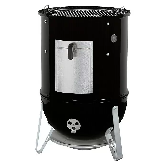 Weber Ahumador Mountain Cooker - Diámetro de la superficie de la parrilla: 47 cm, Negro - Parrilla ahumadora vertical negra con asas de parrilla, puerta de acceso y patas plateadas.