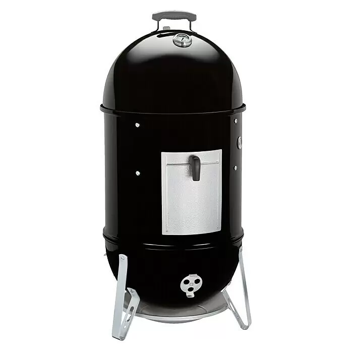 Weber Ahumador Mountain Cooker - Diámetro de la superficie de la parrilla: 47 cm, Negro - Ahumador vertical negro estilo Weber con tapa abovedada, termómetro, puerta de acceso y patas plateadas.