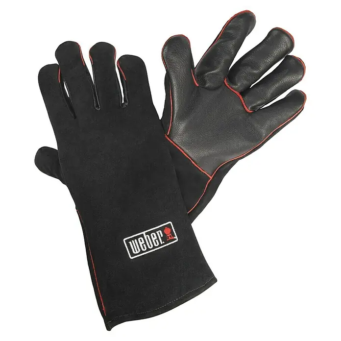 Weber Grillhandschuhe - 2 -tlg., Leder - Das Bild zeigt ein Paar Weber Grillhandschuhe, die speziell für den Umgang mit heißen Grills entworfen wurden. Sie sind aus robustem Material gefertigt.