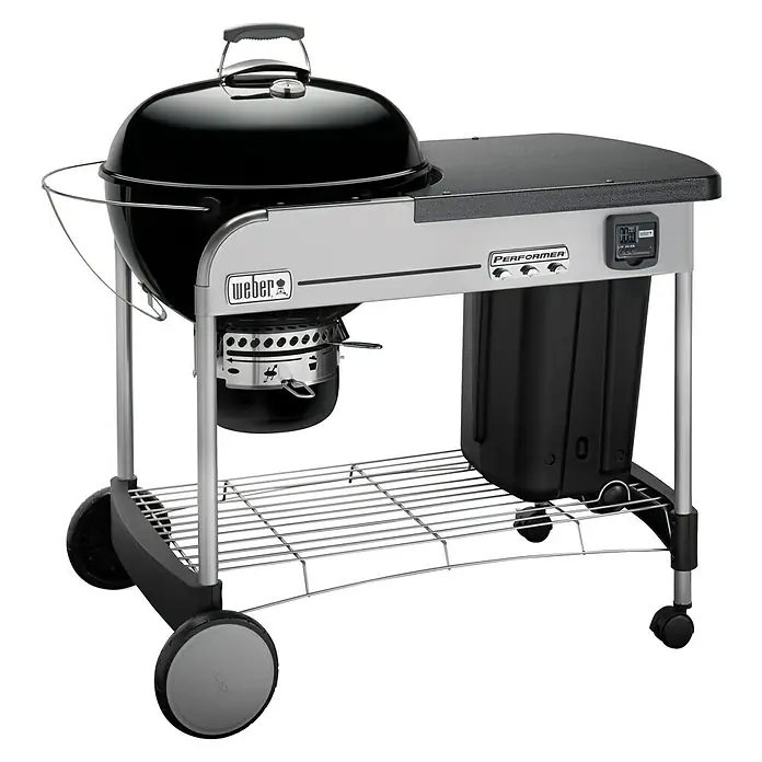 Weber Barbacoa de carbón Performer premium GBS 57 - Diámetro de la superficie de la parrilla: 57 cm, Negro - Barbacoa de carbón Weber con práctica mesa auxiliar. El carro ofrece espacio extra de almacenaje y superficie de trabajo.
