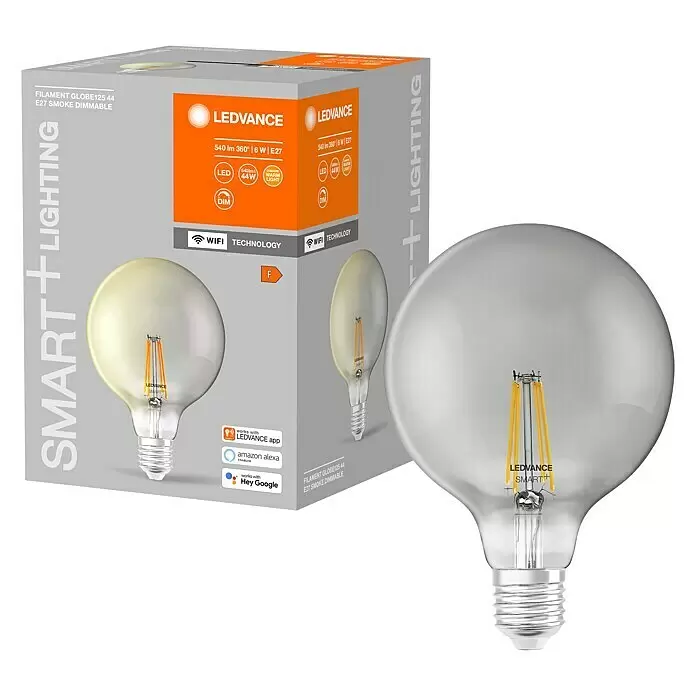 Ledvance Smart+ WiFi Bombilla LED Vintage Globo Smoke - E27, Blanco cálido, 540 lm, 6 W - Bombilla LEDVANCE Smart+ G125 de filamento ahumado E27, junto a su embalaje gris y naranja con funciones inteligentes.