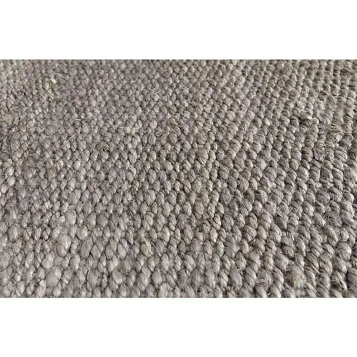 Alfombra de yute Córdoba - Gris, 230 x 160 cm, 100% yute - Primer plano detallado de una alfombra gris resistente que muestra una textura artesanal distintiva que irradia calidez y elegancia natural.