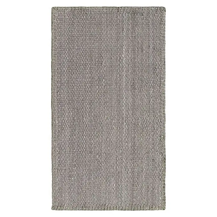 Alfombra de yute Córdoba - Gris, 150 x 80 cm, 100% yute - Una alfombra rectangular gris con una textura tejida y un borde atado, perfecta para agregar calidez a cualquier espacio habitable.
