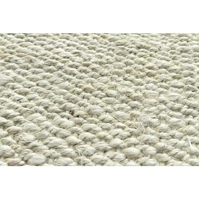 Alfombra de yute Córdoba - Blanco, 170 x 120 cm, 100% yute - Primer plano de una alfombra tejida a mano que muestra su textura robusta y paleta de colores neutros, ideal para una decoración natural.