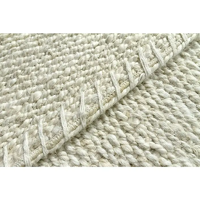 Alfombra de yute Córdoba - Blanco, 170 x 120 cm, 100% yute - Primer plano de una alfombra tejida con fibras naturales, mostrando su textura y detalles decorativos de tejido.