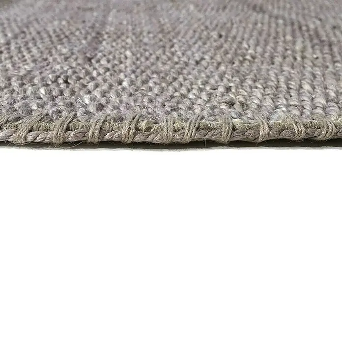 Alfombra de yute Córdoba - Gris, 230 x 160 cm, 100% yute - Vista detallada de una alfombra tejida en gris, que muestra la textura y la artesanía de la alfombra.