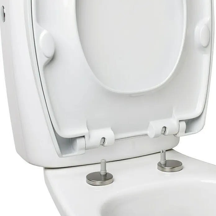 Tatay Tapa de WC Optima - Plástico, Blanco, Con caída amortiguada - Primer plano de un asiento de inodoro blanco con bisagras de acero inoxidable, destacando el diseño limpio y moderno del producto.