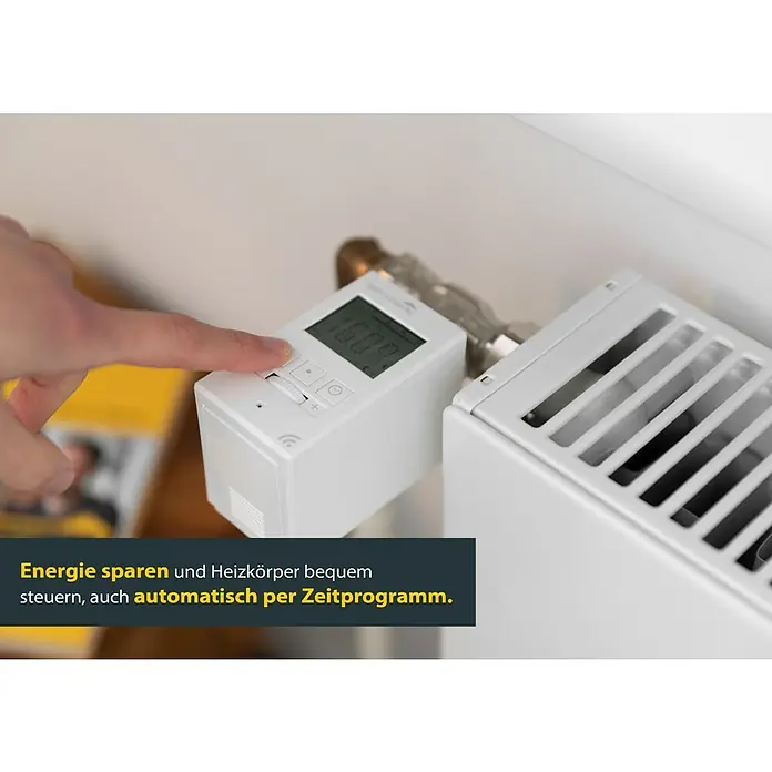 Schellenberg Raumthermostat - Weiß, L x B x H: 65 x 50 x 88 mm - Intelligenter Heizkörperthermostat in Weiß wird von einer Hand bedient, um Energie zu sparen und die Temperatur zu steuern.