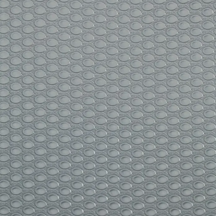 Wenko Antirutschmatte - Grau, L x B: 150 x 50 cm - Grauer Texturhintergrund mit einem Muster aus sich wiederholenden, versetzten Kreisen, die eine gleichmäßige Oberfläche für verschiedene Anwendungen bieten.