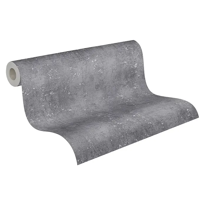 A.S. Création Titanium 3 Vliestapete I - Anthrazit, Betonoptik, 10,05 x 0,53 m - Nahaufnahme einer Rolle strukturierter, grauer Tapete mit subtilen weißen Akzenten, die auf einer schwarzen Oberfläche ausgerollt ist.