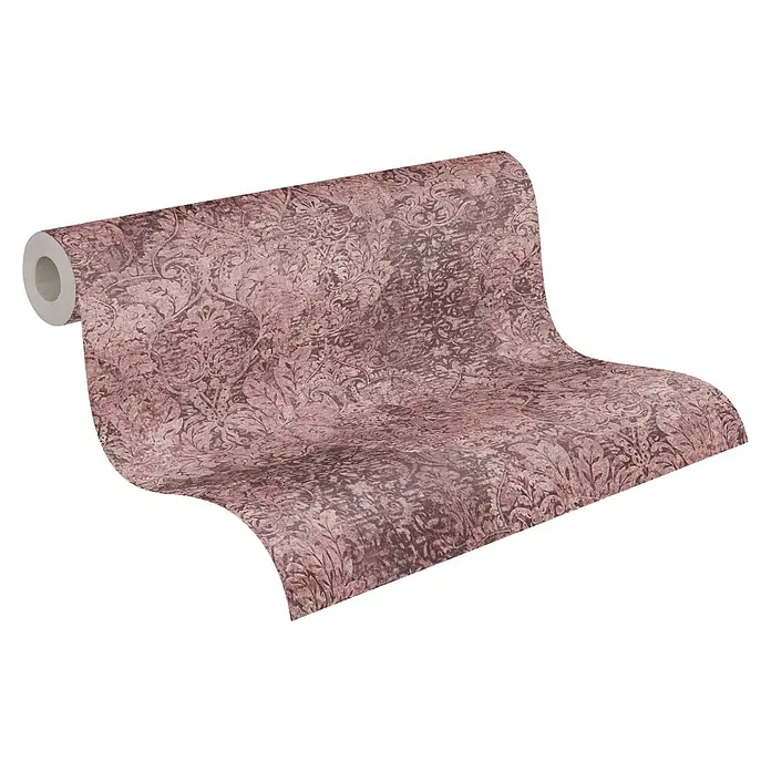 A.S. Création Mata Hari Vliestapete Barock antik - Rosa/Rot, Ornament, 10,05 x 0,53 m - Nahaufnahme einer Rolle detailreicher, braun-rosa gemusterter Tapete, die ausgerollt auf einer ebenen Fläche liegt.