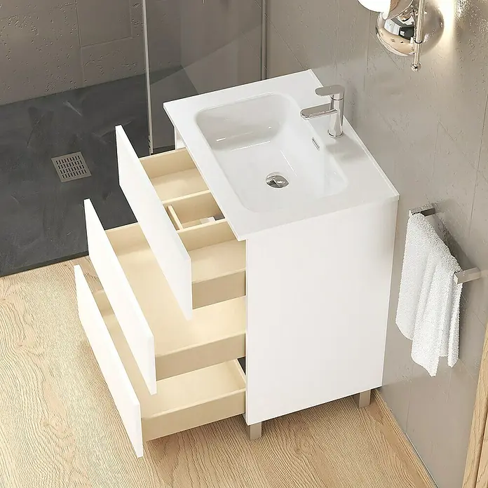 Artysan Conjunto de mueble de baño Basic 3C - Ancho: 60 cm, Ancho total del mueble de baño: 60 cm, Blanco, Mate, 3 pzs. - Un moderno mueble de lavabo blanco con tres cajones abiertos. Toalla colgando en el lateral.