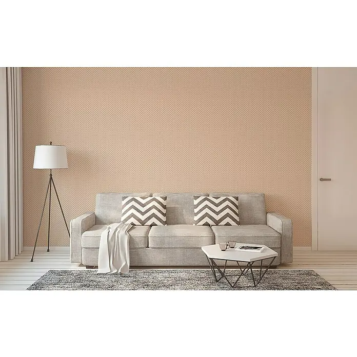 A.S. Création Trendwall 2 Vliestapete Art Deco klein - Beige, Grafisch, 10,05 x 0,53 m - Gemütliches Wohnzimmer mit grauem Sofa, Zickzack-Kissen, Stehlampe und einem Couchtisch auf einem grauen Teppich vor einer getäfelten Wand.