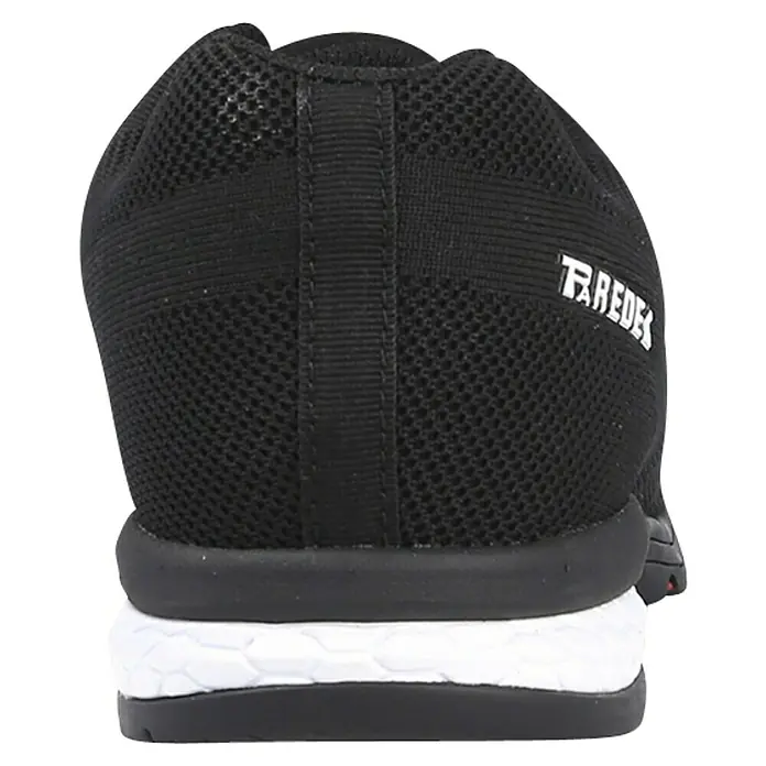Paredes Zapato bajo de seguridad Cheste - 36, Clase de protección según EN ISO 20345: S1P, Negro/Blanco - Primer plano de una zapatilla de correr negra con parte superior de malla, entresuela blanca y la palabra "TRAEDES" escrita en el lateral.
