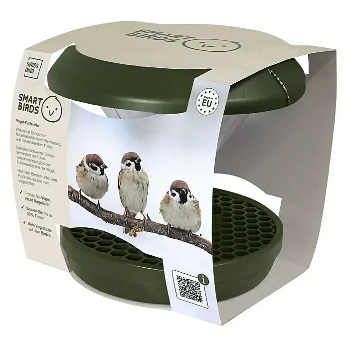 Swissinno Futtersäule Smart Birds - Kunststoff, Dunkelgrün - Grünes Vogelfuttersilo aus Kunststoff in Kartonverpackung, mit Etikett 'SMART BIRDS' und Spatzenbild.