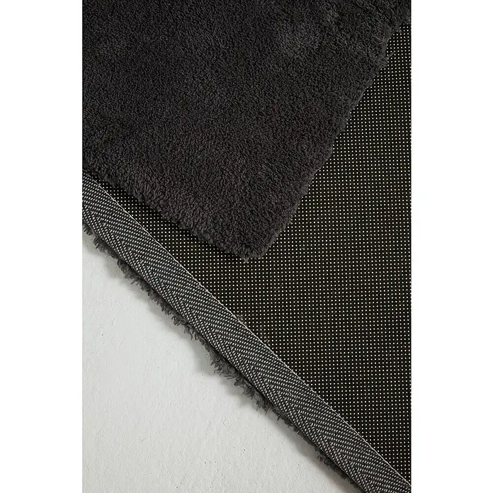 Alfombra de pelo corto Toscana - Gris, 170 x 120 cm, 100% Poliéster - Primer plano de una alfombra de baño gris con soporte antideslizante, que combina comodidad y seguridad en el baño.
