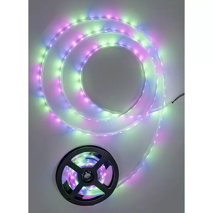 BAUHAUS Guirnalda luminosa solar - Largo: 3 m, LED, Blanco neutro - Tira de luces LED multicolor, verde, rosa y azul, parcialmente desenrollada de un carrete negro.