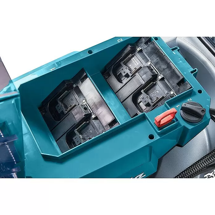 Makita LXT 18V Akku-Rasenmäher DLM537Z - 36 V, Ohne Akku, Schnittbreite: 53 cm - Türkises Akkufach eines Elektrowerkzeugs mit zwei 18V-Batterieschächten, rotem Hebel und schwarzem Moduswähler.