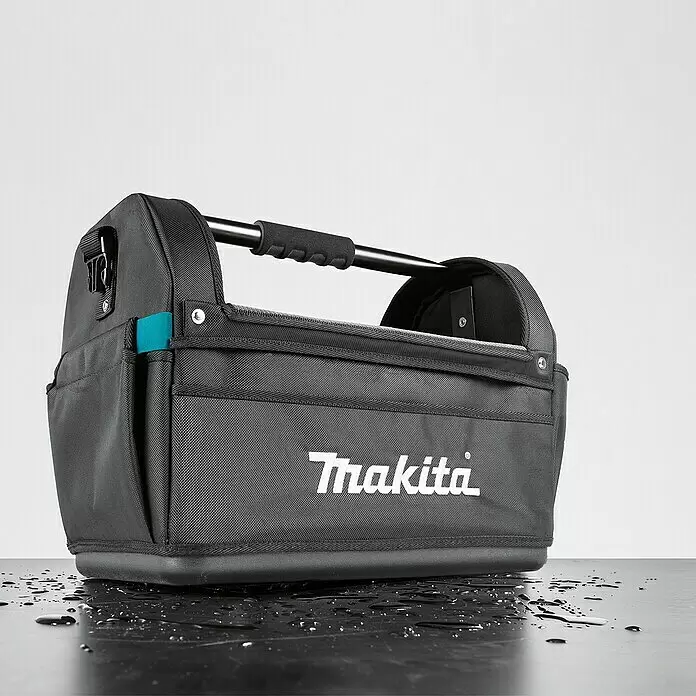 Makita Werkzeugtasche offen E-15403 - 490 x 310 x 355 mm - Dunkelgraue Makita Werkzeugtasche mit robustem Metallgriff, gepolstertem Griff und einem türkisen Akzent.
