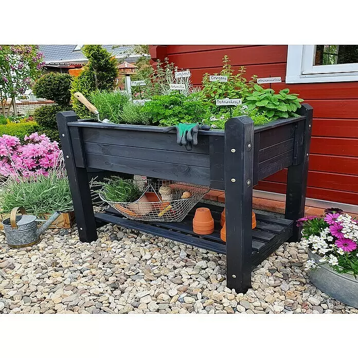 Promadino Kräuterhochbeet - L x B x H: 114 x 60 x 84,5 cm, Anthrazit - Schwarzes Hochbeet aus Holz, bepflanzt mit Kräutern, Gartengeräte und Tontöpfe auf der Ablage.