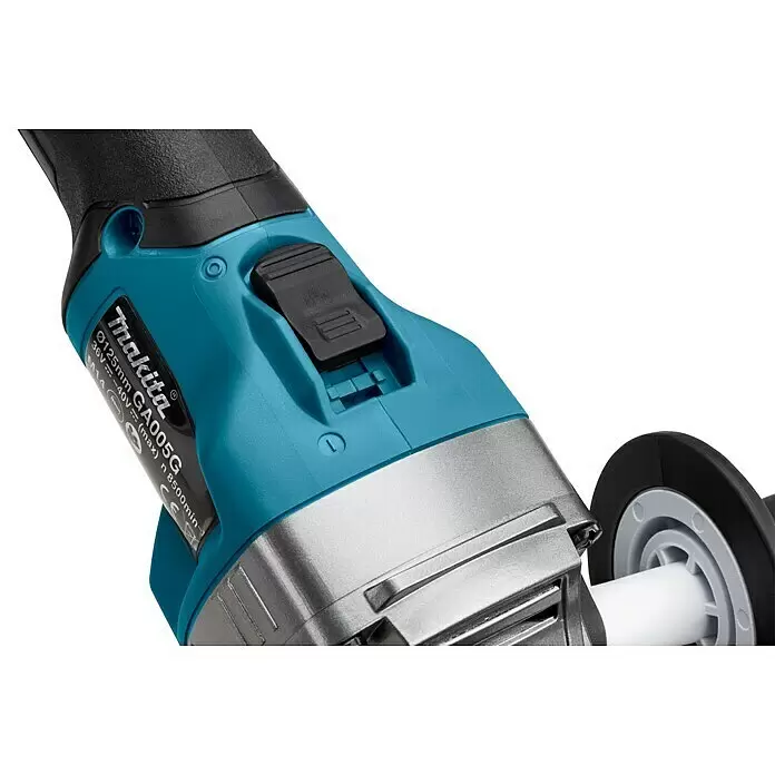 Makita XGT 40V max. Akku-Winkelschleifer GA005GM201 - 2 Akkus, 4 Ah, Leerlaufdrehzahl: 8.500 U/min - Nahaufnahme eines türkis-schwarzen Makita GA005G Winkelschleifers mit Schalter und Metallkopf.