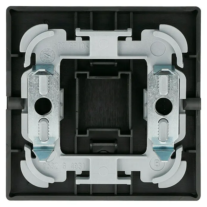 Busch-Jaeger Future Linear Universalwippe 1786-885 - Schwarz matt, Kunststoff - Nahaufnahme einer schwarzen Unterputzdose mit Befestigungselementen, ideal für Elektroinstallationen im Innenbereich.