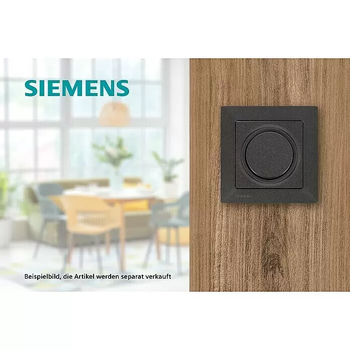 Siemens DELTA Mega Dimmerabdeckung SIE039543 - Carbon Metallic, Glänzend, Kunststoff, Unterputzmontage - Matter schwarzer Siemens Schalter/Dimmer mit rundem Bedienfeld, auf einer Holzplatte in häuslicher Umgebung installiert.