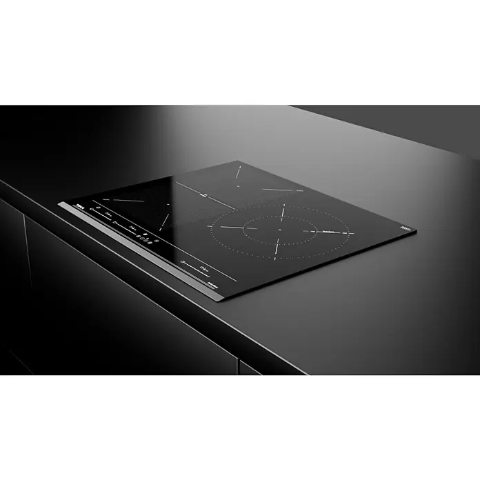 Teka Placa de cocción IZF65320BKMSP - An x L: 51,5 x 60,5 cm - La imagen muestra una elegante placa de inducción negra, integrada en una encimera de cocina lisa y oscura. Diseño minimalista para cocinas modernas.
