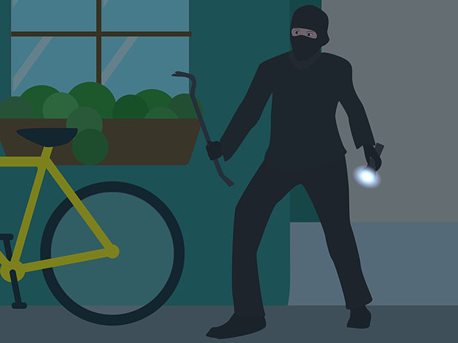 Einbrecher mit Taschenlampe