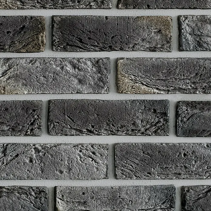 Papel pintado de vinilo Autoadhesivo Arcilla - 2,8 m x 90 cm, Antracita - Primer plano de ladrillos gris oscuro con una textura rugosa y mortero gris claro.