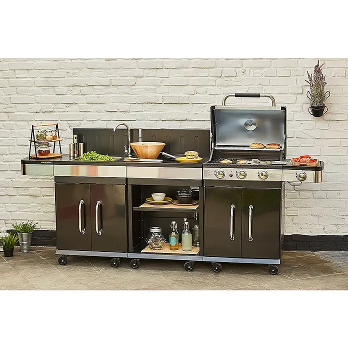 Mueble auxiliar modular para barbacoa Fidgi - Negro/Plateado - Una cocina móvil para exteriores con fregadero, superficie de trabajo y parrilla, diseñada para experiencias culinarias al aire libre.
