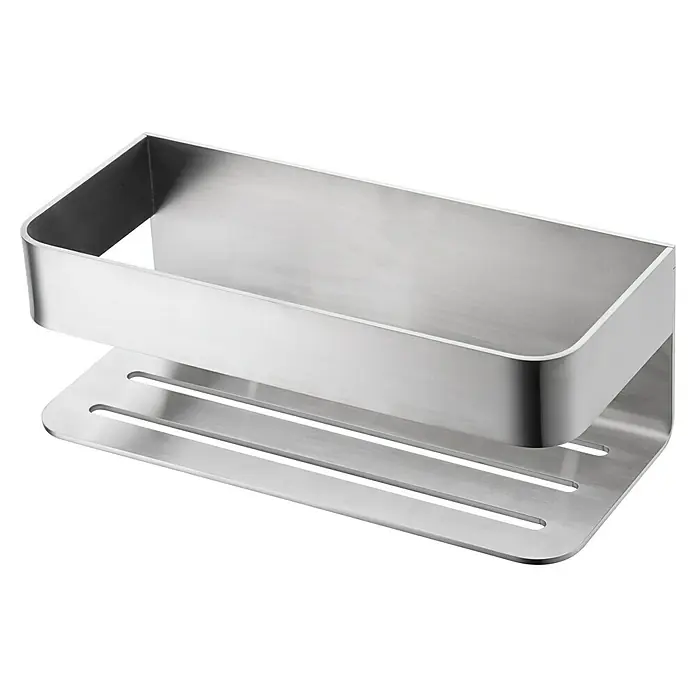Imex Cesta de baño Mayura - 11 x 25,6 x 8 cm, Acero inoxidable, Níquel - Un estante de ducha plateado con un diseño rectangular y ranuras de drenaje sobre una superficie negra.