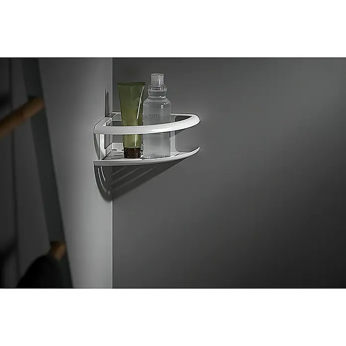 Imex Cesta de baño angular Dhanu - 20 x 20 x 9 cm, Acero inoxidable, Blanco - Una estantería esquinera de metal con productos de baño, montada en una pared gris. Almacenamiento práctico para el baño.