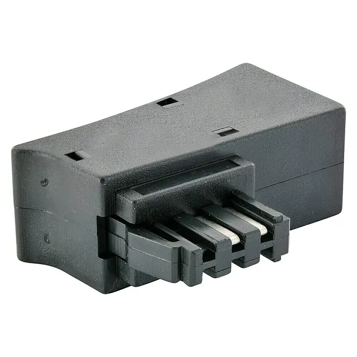 Schwaiger TAE-Adapter TAE/DSL - RJ45-Buchse, TAE-F-Stecker - Detailaufnahme eines schwarzen Steckverbinders. Das Produkt verfügt über mehrere Metallkontakte und ist für elektronische Geräte geeignet.