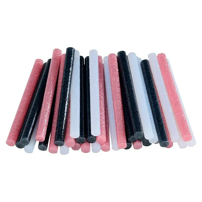 Rapid Klebepatronen Glitzer - Durchmesser Klebepatrone: 7 mm, Weiß/Pink/Schwarz Glitzer - Das Bild zeigt eine Nahaufnahme von schwarzen, weißen und rosafarbenen Glitzerklebestiften, die sich überlappen und ein schönes Muster ergeben.