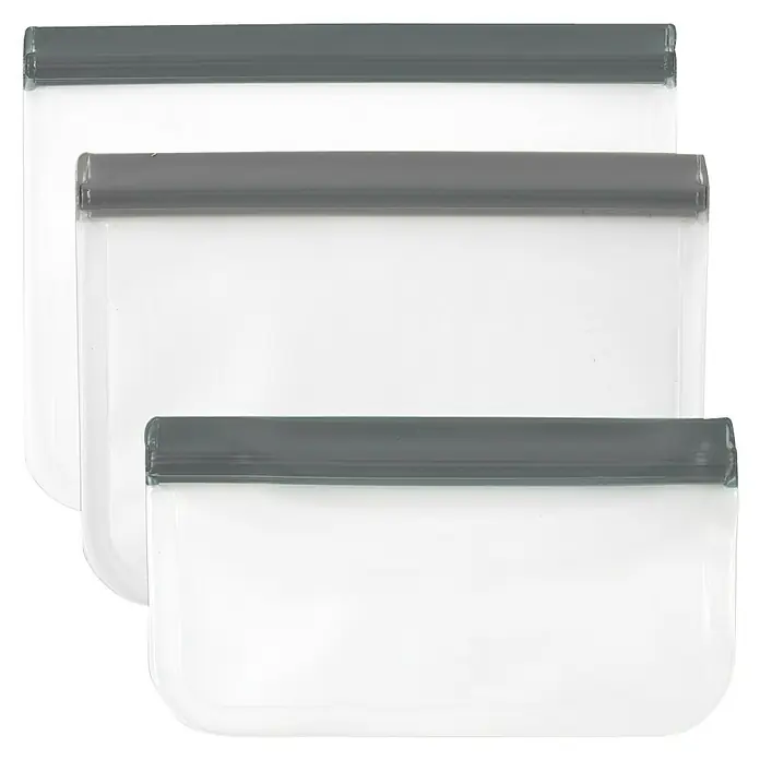 Set de bolsas de vacío reutilizables - 3 ud., Plástico - Esta imagen muestra tres bolsas transparentes e impermeables con cierres grises, ideales para proteger objetos de la humedad.