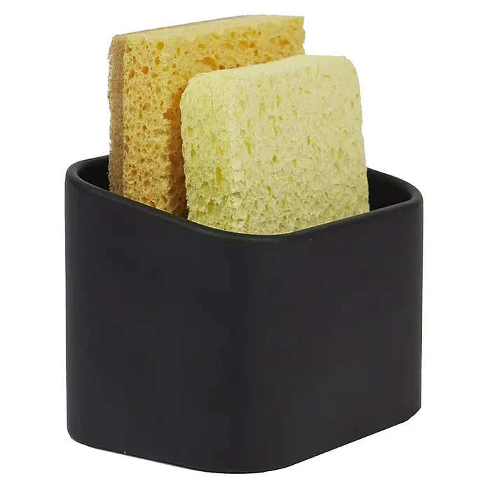 Cesta para la esponja de cocina - L x An x Al: 8 x 8 x 10 cm, Plástico - Dos esponjas en un recipiente negro, ideal para usar en la cocina. Las esponjas son amarillas y verde claro y se ven limpias.