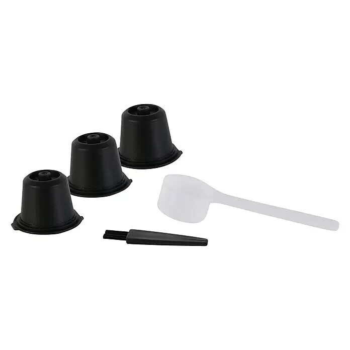 Cápsulas de café reutilizables - 3 ud., Específico para: Nespresso - Tres cápsulas de café negras reutilizables con una cuchara medidora blanca y un cepillo de limpieza.