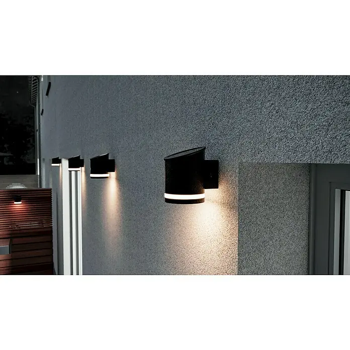 BAUHAUS LED-Solar-AußenwandleuchteAnthrazit, 12 x 9 x 12,5 cm - Diese Aufnahme zeigt stilvolle, schwarze Wandleuchten mit integriertem Licht, die eine moderne Außenbeleuchtungslösung bieten.